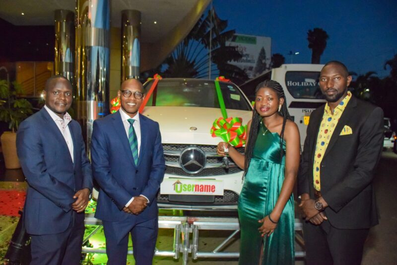 Username-Investment-Directors-posing-for-a-photo-after-handing-over-car-keys-to-Esther-Naima-Asst.-Sales-Manager-after-she-won-Employee-of-the-Year-Award-during-2023